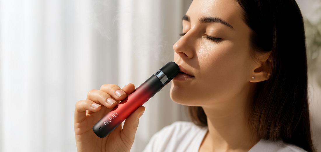 Person inhaling calming vapors from an aromatic diffuser, illustrating immediate stress and tension relief.